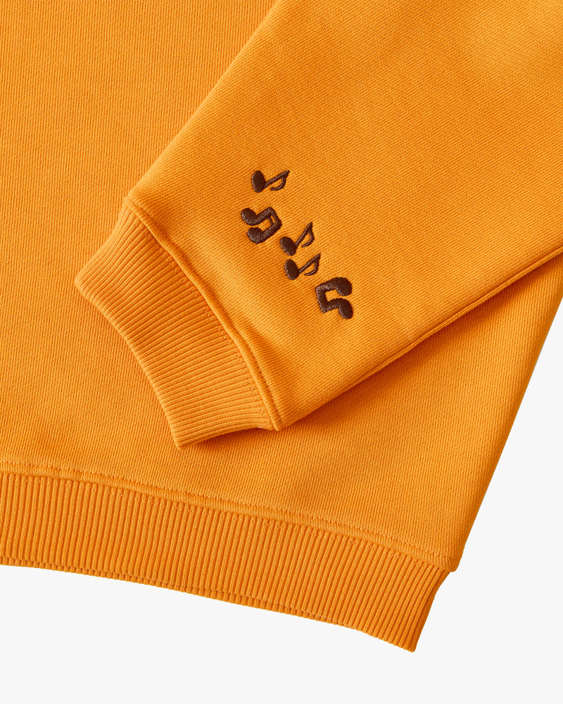 CREWNECK BOXY NARANJA RADIO